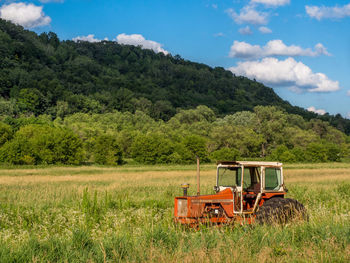 Tractor on countryside landscape