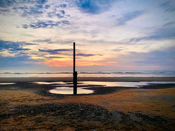 Scenic view of beach during sunset