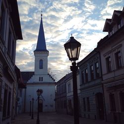 Low angle view of building against cloudy sky