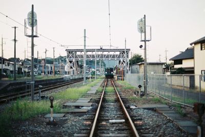 Railroad tracks against clear sky