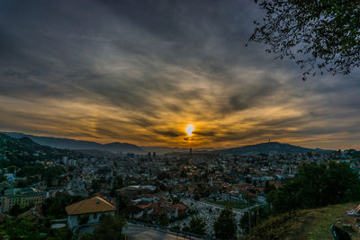 High angle shot of townscape against sky at sunset