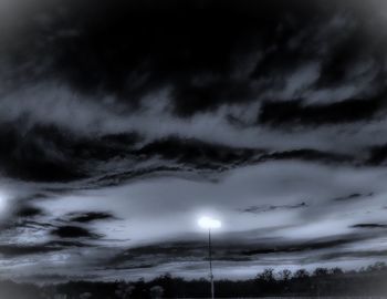 Low angle view of dramatic sky at night