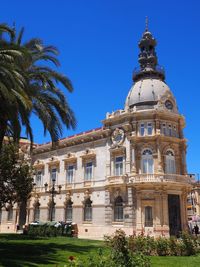 Low angle view of building against blue sky