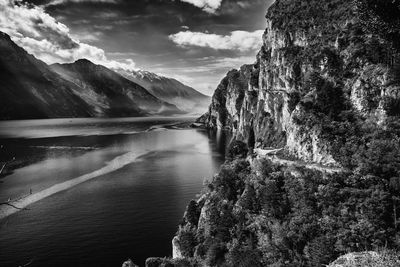 Scenic view of lake and mountains against sky