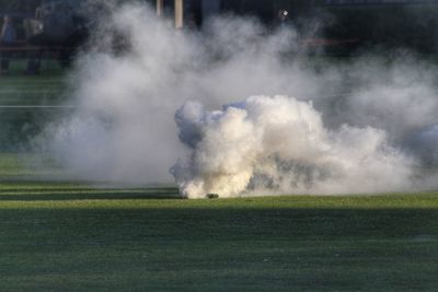 Smoke emitting from volcanic on field