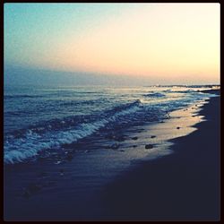 Scenic view of sea at sunset