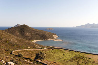 A view of a seascape, beach and island in patmos, greece in summer time