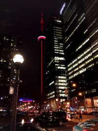 View of skyscrapers lit up at night