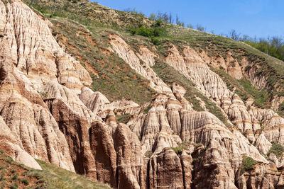 Scenic view of rocky mountains against sky