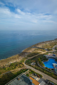 High angle view of road by sea against sky