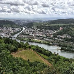 Aerial view of river passing though city