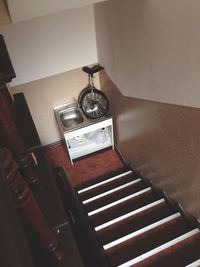 High angle view of clock hanging on wall at home