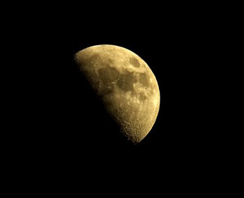 Low angle view of moon against sky at night