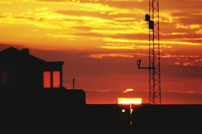 Silhouette of building at sunset