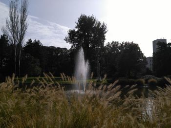 Scenic view of waterfall against sky