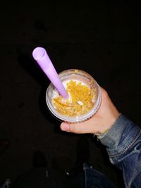 High angle view of hand holding ice cream