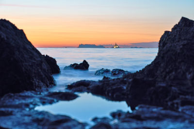 Scenic view of sea against sky during sunset