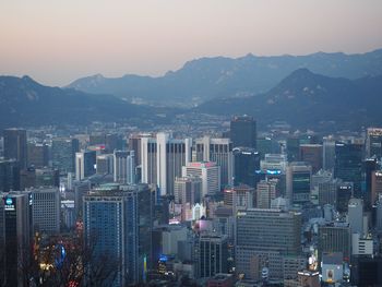 High angle view of buildings in city against sky