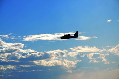 Low angle view of airplane against sky