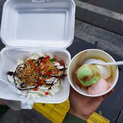 High angle view of person holding food