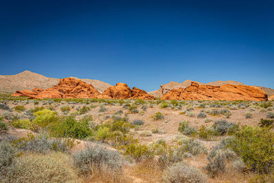 Scenic view of rocky mountains against clear blue sky