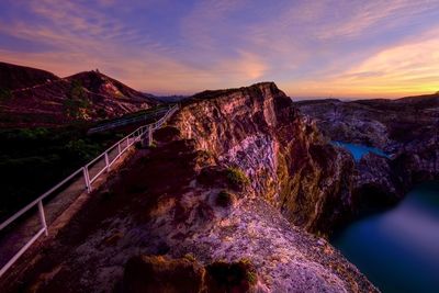 Scenic view of rock formation against sky during sunset