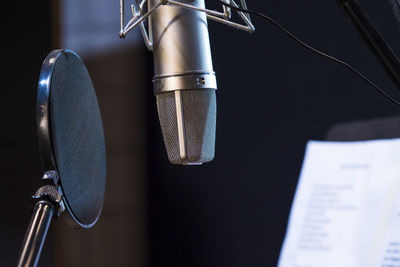 Close-up of microphone with soundproof in recording studio