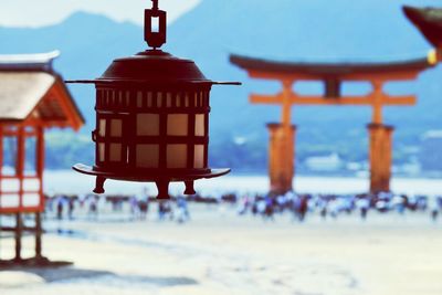 Close-up of lantern hanging against sky