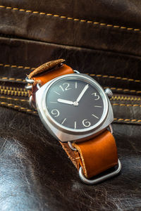 High angle view of clock on table