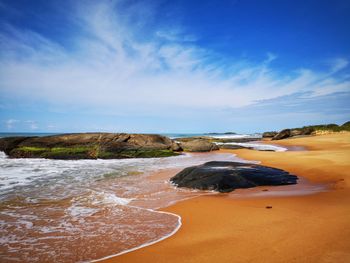 Scenic view of beach against sky