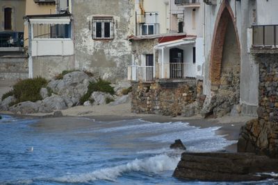 Scenic view of sea against building
