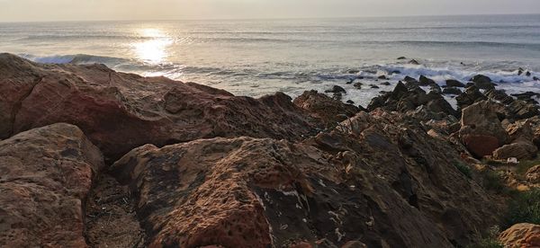 Scenic view of sea against sky during sunset