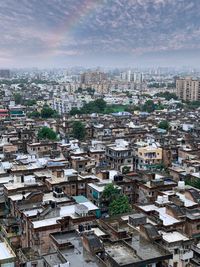 High angle view of buildings in city against sky