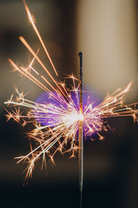 Close-up of sparkler at night