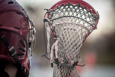 Close-up of player with lacrosse sports equipment