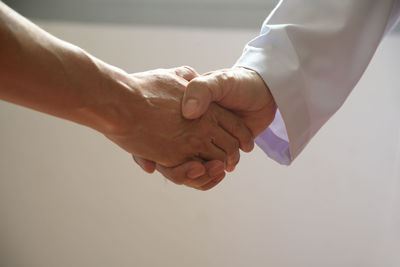 Close-up of couple holding hands