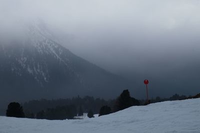 Scenic view of mountains against sky during winter