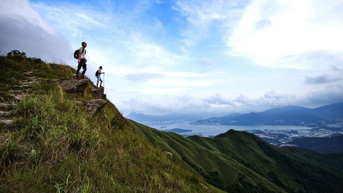 Scenic view of mountains against cloudy sky