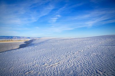 Scenic view of landscape against blue sky