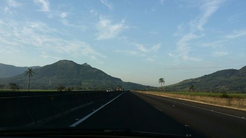 Country road leading towards mountains