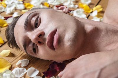 Close-up of young woman lying down