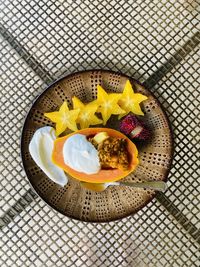 High angle view of tropical fruit breakfast served on table