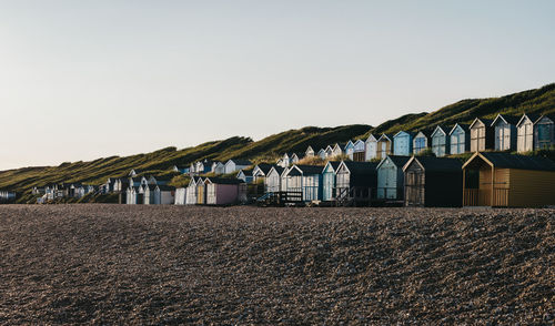 Beach huts against sky