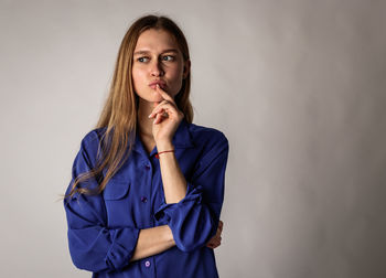 Portrait of a beautiful young woman over white background