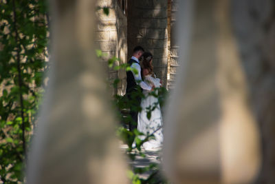 Woman standing by plants