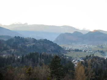 High angle view of trees and mountains against sky