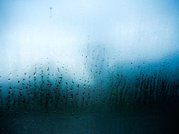 Full frame shot of wet glass window