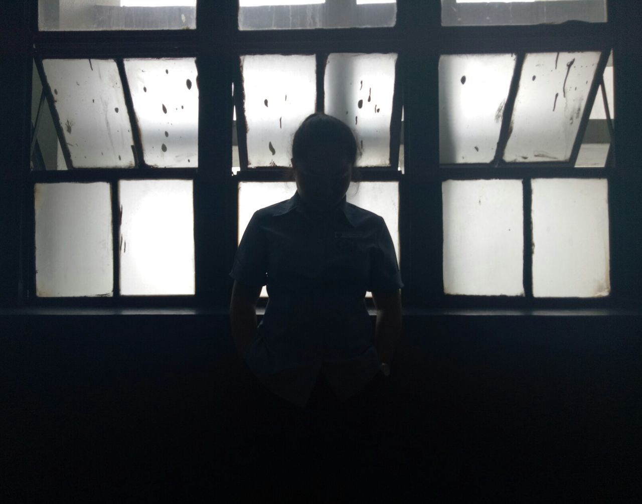 window, indoors, one person, standing, silhouette, real people, men, day, people