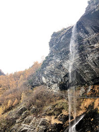 Aerial view of rock formation on land against sky