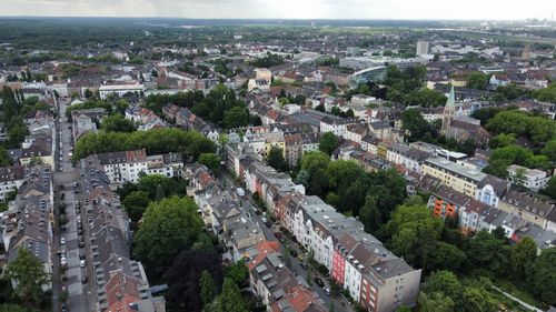 High angle view of street amidst buildings in town